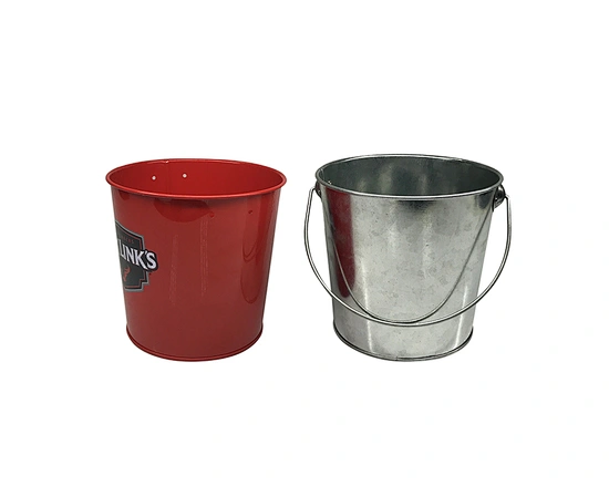 The small tin buckets were a charming addition to any event or decor. With their compact size and various colors, they added a playful touch to the atmosphere.