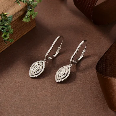 silver face earrings