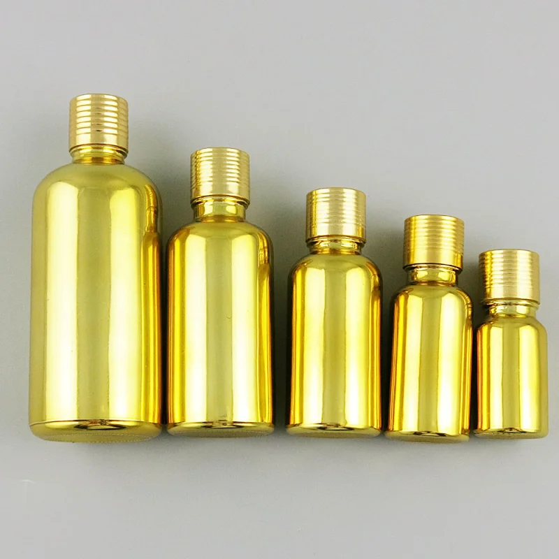Gold glass essential oil bottles containers packaging with reducer aluminum lids 100ml 50ml 30ml 20ml 15ml 10ml 5ml