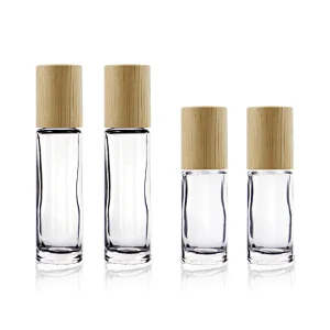 wholesale 5ml 10ml Refillable Bamboo Roll On Bottle Essential Oil Clear Glass Stainless Steel Roller Bottle With Bamboo Cap
