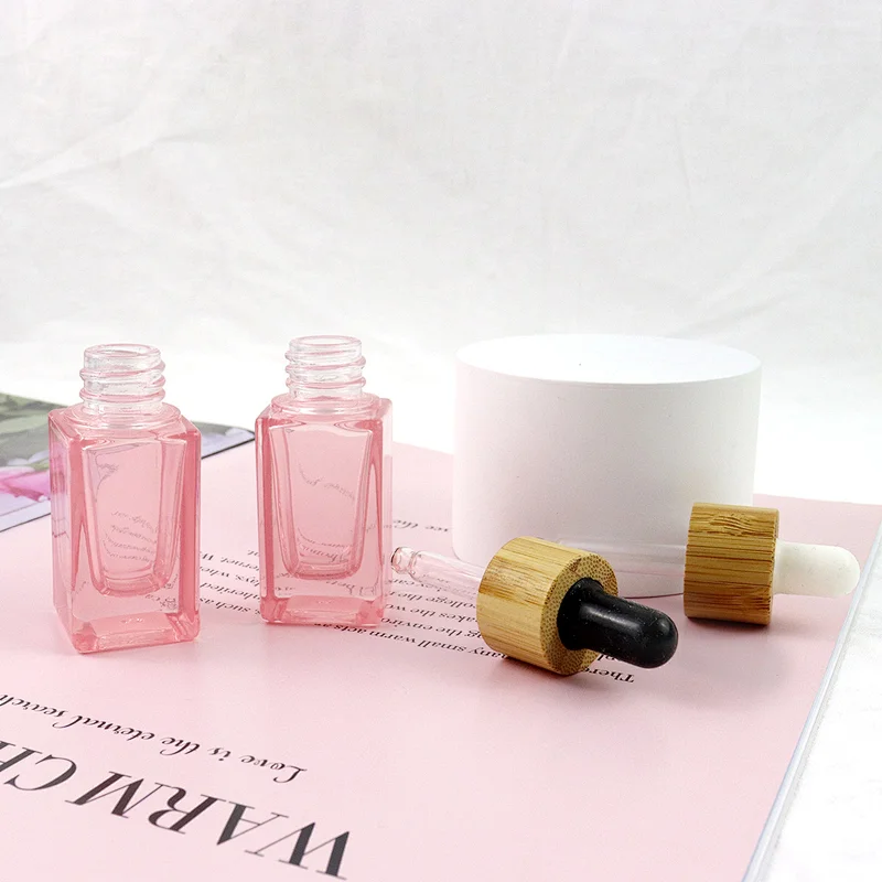 2022 New Trends Wholesale Cosmetic Package Pink Glass Bottle Dropper Square Shape Clear 10mL Glass Bottle With Bamboo Cap