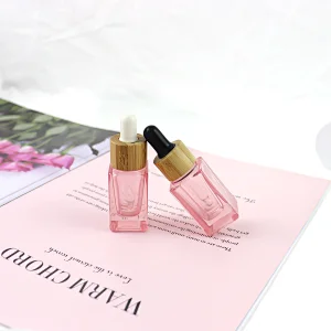 2022 New Trends Wholesale Cosmetic Package Pink Glass Bottle Dropper Square Shape Clear 10mL Glass Bottle With Bamboo Cap