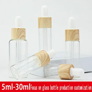 5mL 10mL 15mL 20mL 30mL high end clear dropper cylinder glass essential oil bottles with wooden grain lid