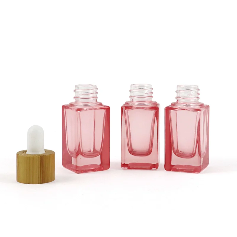 2022 New Trends Wholesale Cosmetic Package Pink Glass Bottle Dropper Square Shape Clear 10mL Glass Bottle With Bamboo Cap