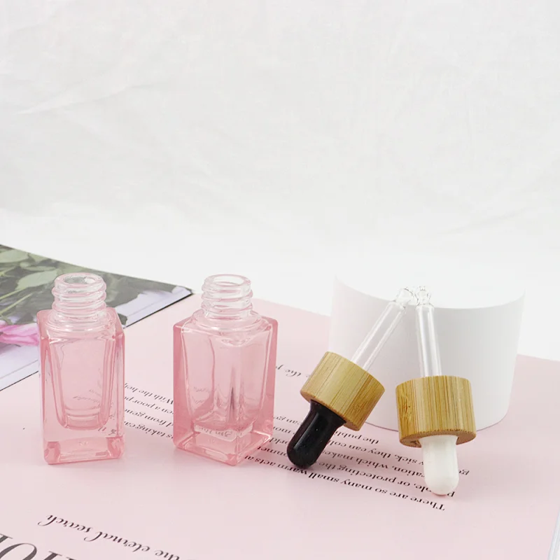 2022 New Trends Wholesale Cosmetic Package Pink Glass Bottle Dropper Square Shape Clear 10mL Glass Bottle With Bamboo Cap