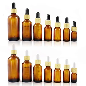 Wholesale Skin Care Essential Oil Serum Bottle Clear Amber Glass Dropper Bottle With Bamboo Dropper Cap