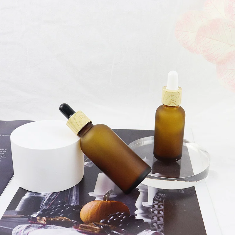 Wholesale Skin Care Essential Oil Serum Bottle Frosted Amber Glass Dropper Bottle With Bamboo Dropper Cap