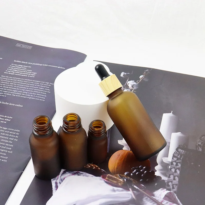 Wholesale Skin Care Essential Oil Serum Bottle Frosted Amber Glass Dropper Bottle With Bamboo Dropper Cap
