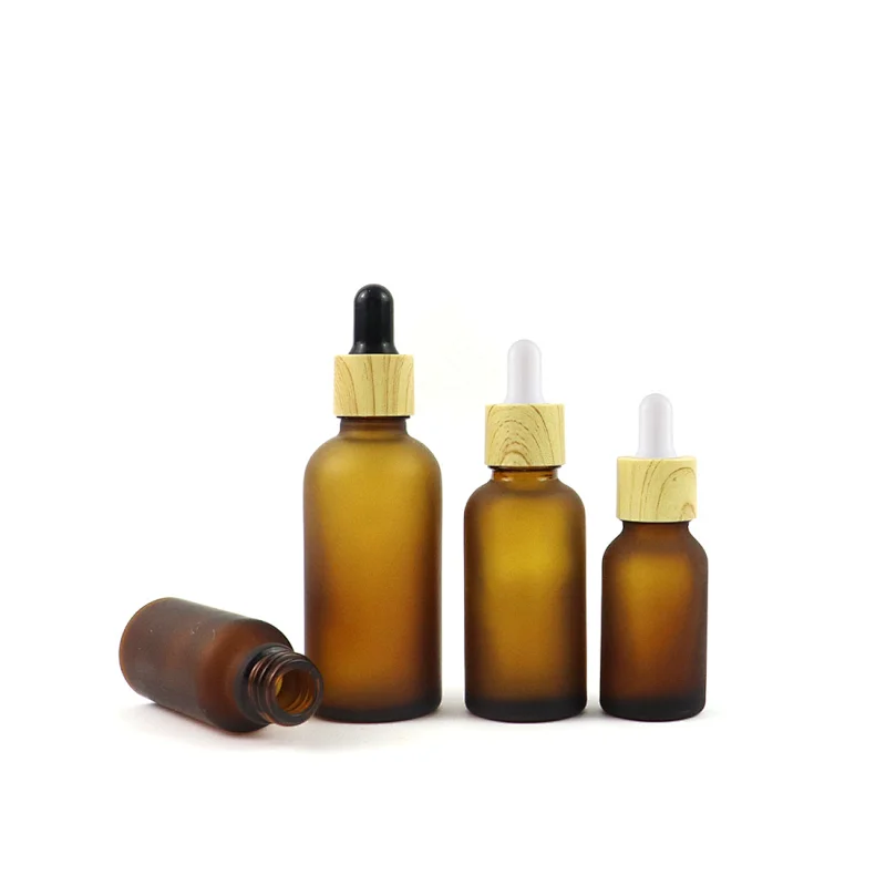 Wholesale Skin Care Essential Oil Serum Bottle Frosted Amber Glass Dropper Bottle With Bamboo Dropper Cap