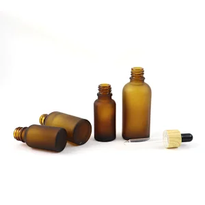 Wholesale Skin Care Essential Oil Serum Bottle Frosted Amber Glass Dropper Bottle With Bamboo Dropper Cap