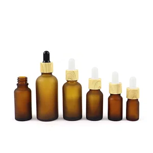 Wholesale Skin Care Essential Oil Serum Bottle Frosted Amber Glass Dropper Bottle With Bamboo Dropper Cap