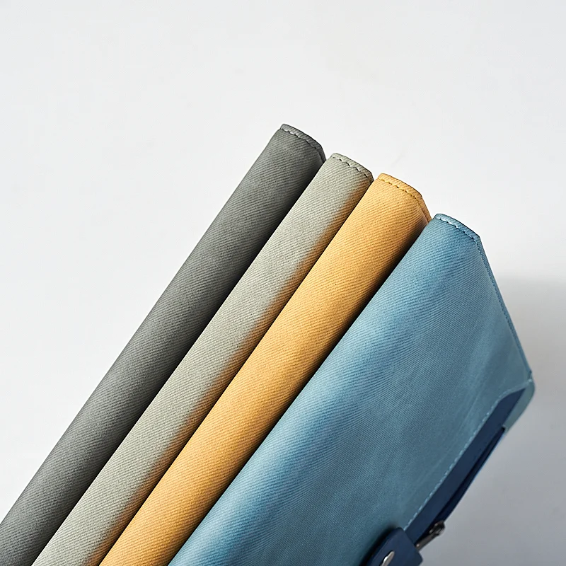 A5 notebook with zipper and belt closure