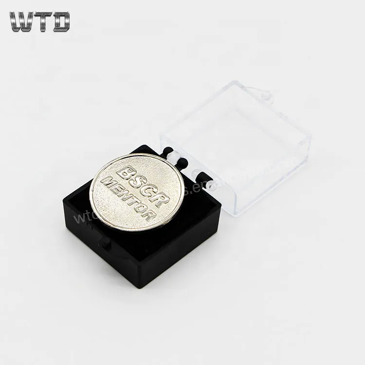 round gold badge with boxes