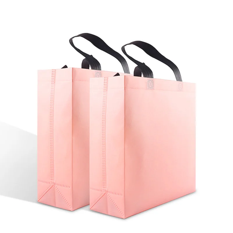 wholesale promotional small laminated pink pp non-woven fabric grocery packaging bags for shopping