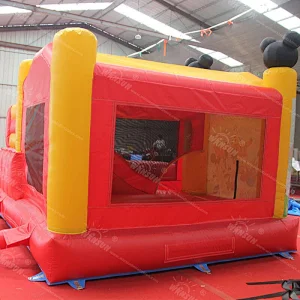 Inflatable jumping castle with slide