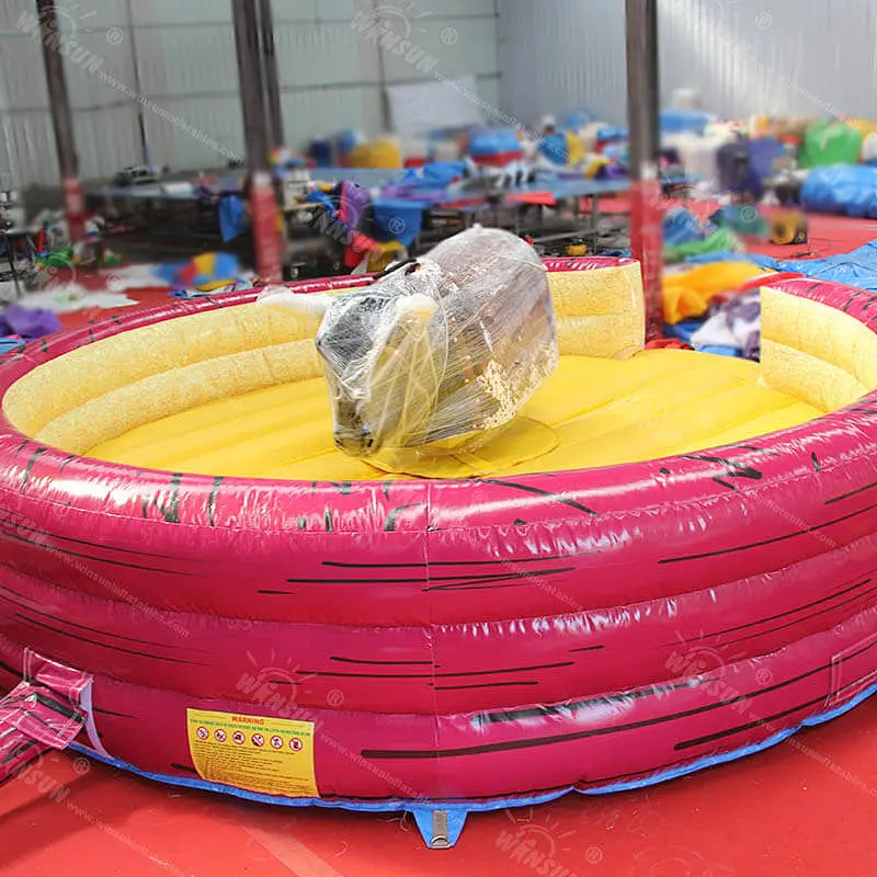 Mechanical bull game with safety mat