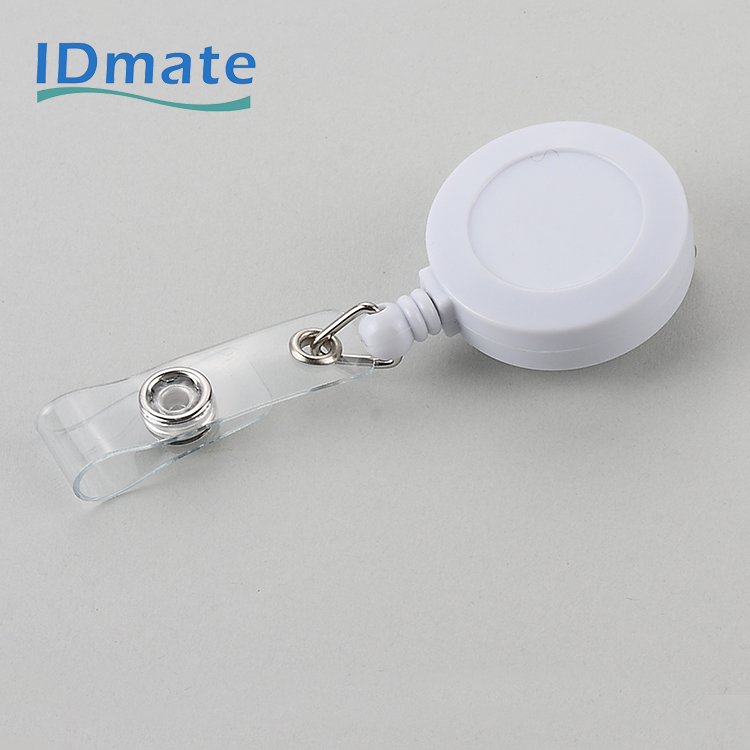 Rotating retractable badge reel