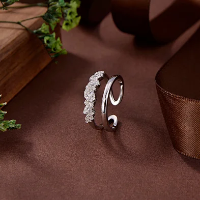 gold wedding band with silver engagement ring