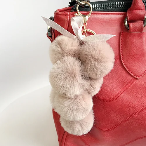 New product small fresh grape imitation rex rabbit fur pom pom honchkrow plush key chain toy accessories women