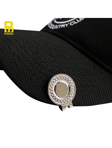 The golf cap clip is a handy accessory to have on the course. It attaches easily to the brim of a hat, keeping a ball marker within reach. Made with sturdy materials, it blends in well with any outfit.