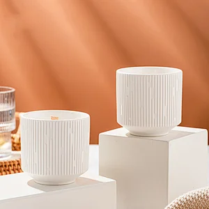 white ceramic candle jars