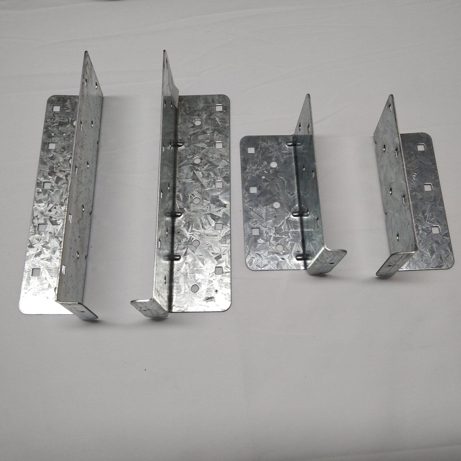 The Surealong split joist hanger is a two‑piece, width‑adjustable joist hanger that can accommodate joist widths from 60mm and 220mm. Each Surealong split joist hanger is comprised of one left and one right piece. It is essential to install nails in the b