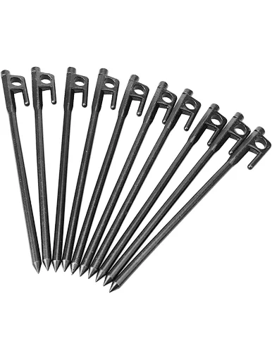 over striking camping tent peg for desert